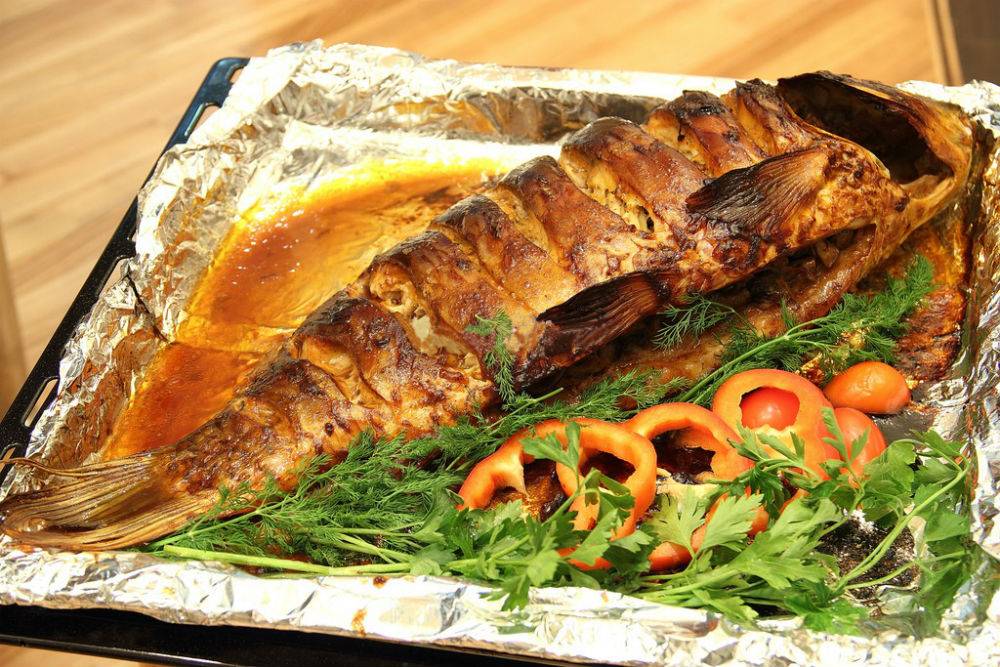 Рыба запеченная в духовке: рецепты приготовления с фото